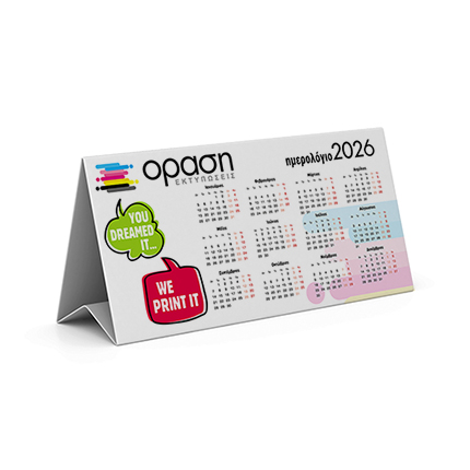 	Ημερολόγιο Τριγωνικό	Το τριγωνικό ημερολόγιο μας συνδυάζει καινοτομία και πρακτικότητα, στέκοντας σταθερά σε κάθε γραφείο ή τραπέζι. Έχει διπλή εκτύπωση, με μηνιαία ημερολόγια στη μία πλευρά και γραφικά ή το λογότυπο της επιχείρησής σας στην άλλη, προσφέροντας μέγιστη ορατότητα.	Κατασκευασμένο από ανθεκτικό χαρτί 150γρ, το ημερολόγιο αυτό διατηρεί τη μορφή του χωρίς να χρειάζεται στήριξη. Η τριγωνική του διάταξη επιτρέπει ευκολία στην τοποθέτηση και την καθημερινή χρήση.	Αναγνωρίζουμε τη σημασία της προβολής του λογοτύπου σας και προσφέρουμε την ευχέρεια προσαρμογής του στα εκτυπωμένα στοιχεία. Το ημερολόγιο αυτό είναι ιδανικό για γραφεία, καταστήματα, ή ως διαφημιστικό δώρο προς πελάτες.	Επιπλέον, οι λεπτομέρειες της διάταξης των μηνών και η ποιότητα της εκτύπωσης είναι αριστοτεχνικά σχεδιασμένες, όπως φαίνεται και από τις φωτογραφίες μας.	Επικοινωνήστε μαζί μας για να δημιουργήσουμε ένα τριγωνικό ημερολόγιο προσαρμοσμένο στις ανάγκες σας και να σχεδιάσουμε τη μακέτα που επιθυμείτε. 