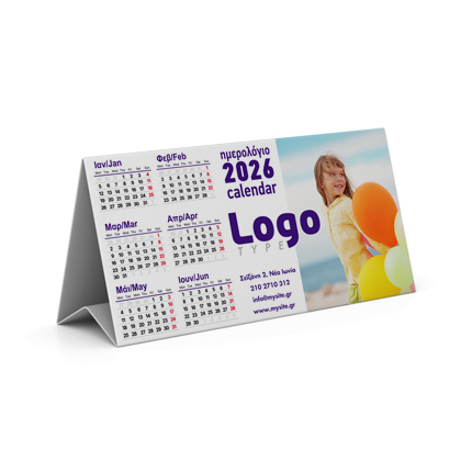 	Ημερολόγιο Τριγωνικό	Ανακαλύψτε το ιδανικό ημερολόγιο για το γραφείο σας, σε τριγωνικό σχήμα 20x10 εκ., που στέκεται σταθερά σε κάθε επιφάνεια. Το ημερολόγιο αυτό διαθέτει εκτύπωση και από τις δύο πλευρές, όπου από τη μία θα βρείτε τα μηνιαία ημερολόγια και από την άλλη γραφικά ή το λογότυπο της επιχείρησής σας.	Κατασκευασμένο από ανθεκτικό χαρτί 150γρ, προσφέρει τέλεια σταθερότητα στη χρήση, με λεπτομέρειες που εντυπωσιάζουν. Η δυνατότητα προσαρμογής των εκτυπώσεων και στις δύο πλευρές εξασφαλίζει μέγιστη προβολή της επιχείρησής σας.	Αν θέλετε να αυξήσετε την ορατότητα της μάρκας σας, το ημερολόγιο είναι ιδανικό για χρήση σε γραφεία, καταστήματα, ή ως διαφημιστικό δώρο προς πελάτες, προσφέροντας συνεχώς την προβολή του λογοτύπου σας σε εμφανές σημείο.	Στο τυπογραφείο μας, μπορούμε να σχεδιάσουμε ένα τριγωνικό ημερολόγιο προσαρμοσμένο στις ανάγκες σας, διασφαλίζοντας την άριστη ποιότητα εκτύπωσης και το κομψό στυλ που επιθυμείτε.	Επικοινωνήστε μαζί μας για περισσότερες λεπτομέρειες. 