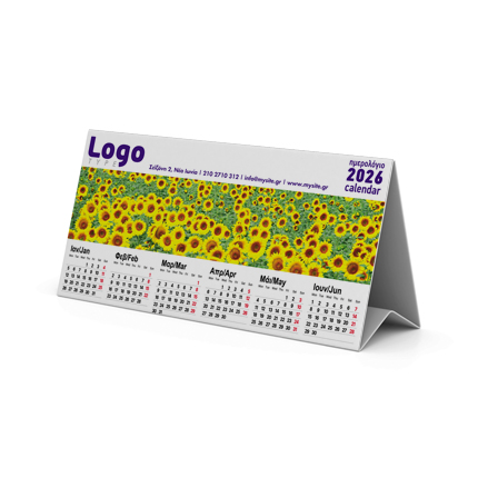 	Ημερολόγιο Τριγωνικό	Το τριγωνικό ημερολόγιο μας είναι η ιδανική επιλογή για γραφεία και επαγγελματικούς χώρους. Με διαστάσεις 20x10 εκ., στέκεται σταθερά πάνω σε γραφείο ή τραπέζι. Το ημερολόγιο διαθέτει εκτύπωση και στις δύο πλευρές: η μία πλευρά φέρει τα μηνιαία ημερολόγια, ενώ η άλλη πλευρά μπορεί να ενσωματώνει γραφικά ή το λογότυπο της επιχείρησής σας.	Κατασκευασμένο από ανθεκτικό χαρτί 150γρ, διατηρεί τη μορφή του χωρίς να χρειάζεται πρόσθετη υποστήριξη. Το τριγωνικό ημερολόγιο προσφέρει τη δυνατότητα προσαρμογής της εκτύπωσης και στις δύο πλευρές για μέγιστη προβολή της επιχείρησής σας.	Η ποιότητα των εκτυπώσεων είναι εξαιρετική, με προσεγμένη διάταξη των μηνών και ελκυστικά χρώματα, διασφαλίζοντας ότι το ημερολόγιο σας θα είναι οπτικά ελκυστικό και λειτουργικό.	Είναι ιδανικό για χρήση σε γραφεία, καταστήματα ή ως διαφημιστικό δώρο προς πελάτες, προσφέροντας συνεχόμενη προβολή του λογοτύπου σας σε εμφανές σημείο.	Επικοινωνήστε μαζί μας για ένα ημερολόγιο προσαρμοσμένο στις ανάγκες σας. 