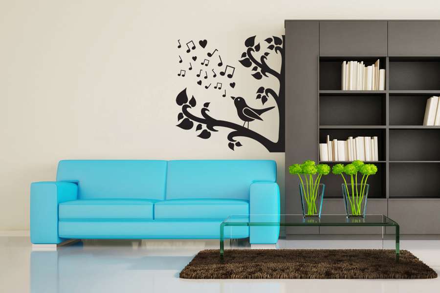 Αυτοκόλλητο τοίχου από βινύλιο που απεικονίζει ένα δέντρο με φύλλα σε σχήμα καρδιάς, με ένα ωδικό πτηνό και νότες. Είναι ανθεκτικό και κολλάει και ξεκολλάει εύκολα.Μπορείτε να μας ζητήσετε να εκτυπωθεί σε ότι διάσταση και χρώμα θέλετε.  