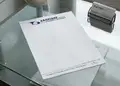 Επιστολόχαρτο με λογότυπο επιχείρησης σε μπλε και γκρι αποχρώσεις, κατάλληλο για επαγγελματική αλληλογραφία.