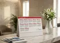 Επιτραπέζιο ημερολόγιο σπιράλ 2027 στην πραγματική ζωή, σε επαγγελματικό περιβάλλον.