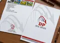 Διπλωμένη μπροσούρα ακινήτων με δυναμικά γραφικά και λογότυπο DP Real Estate.